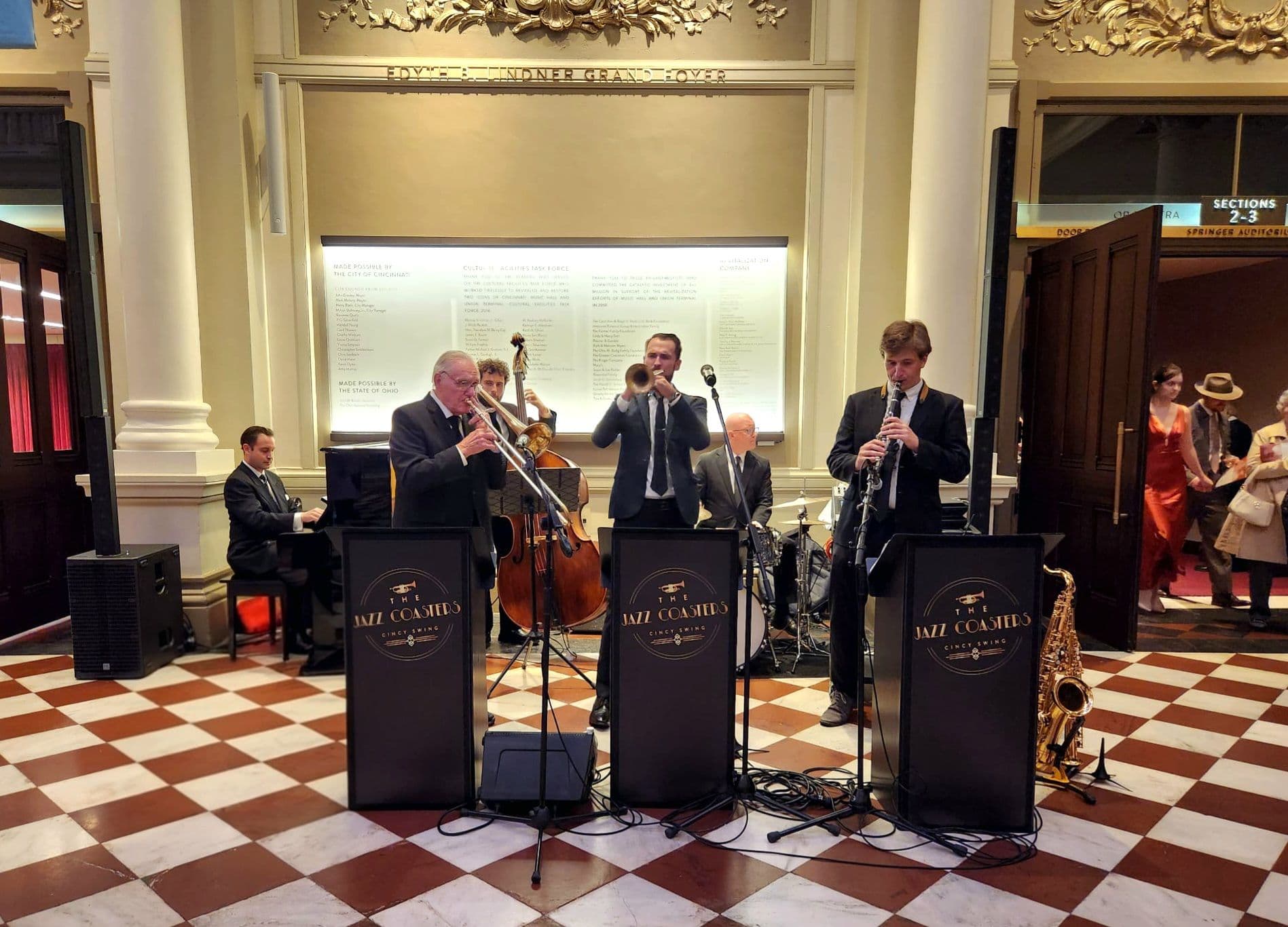 The Jazz Coasters performing live in an ornate ballroom